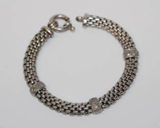 .925 Sterling Diamond Bracelet from  Italy that features 3 secions each containg 16 round diamonds bracelet measures 7.25" long, 18.4 grams total weight, A Well executed classy design!