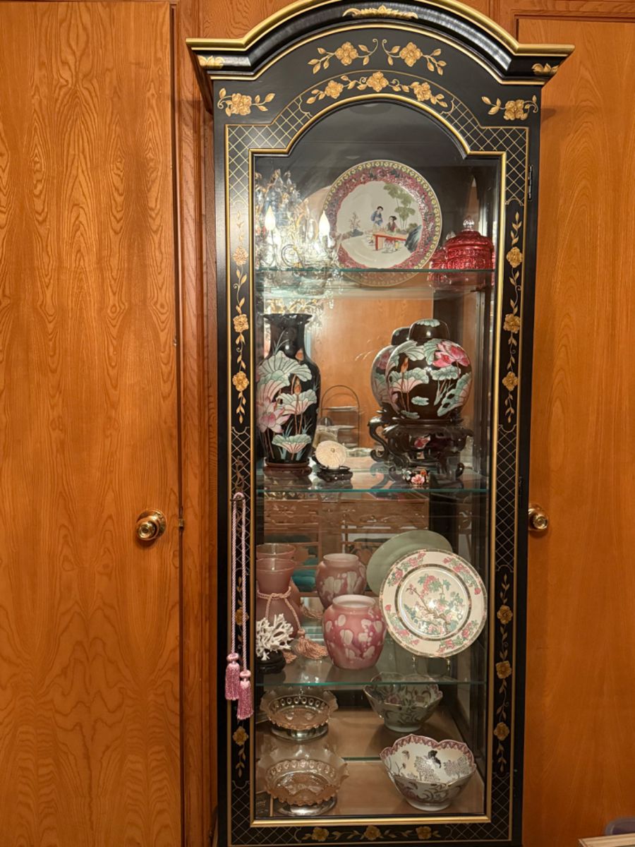 Asian cabinet that lights up with four shelves. $145 Cabinet locks.