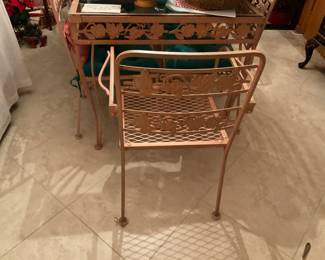 Pink wrought iron/glass dining table  32 X 66 with 8 chairs. Two arm chairs and 6 side. -$495