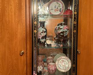 Asian cabinet that lights up with four shelves. $145 Cabinet locks.