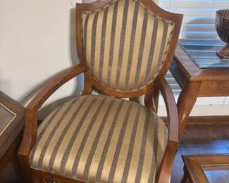 Gold Stripes  are worn well by this Vintage  Chair