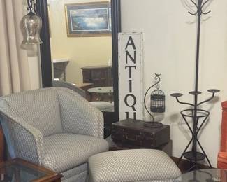 Grey  Print upholstery Reading Chair and matching foot stool with all kinds of Unique Accents surrounding you in your Home
