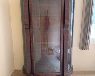 Quarter sawn oak bookcase that has 5   shelves.  The feet were restored and the shelves stripped to their natural state to show off the “Tiger oak “ features. 