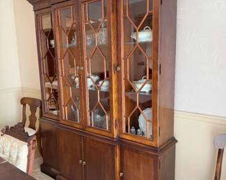 Hutch is mahogany, 2 pieces and has lighting. Made by Hickory Chair Company.  It’s full of beautiful items. I’m sure something will catch your eye!