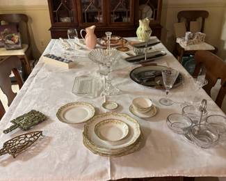 Antique iron stands (use as trivets), GUERIN French Limoges plate setting, antique condiments tray, Heisey glasses, MCM serving pieces, Austrian butter dish