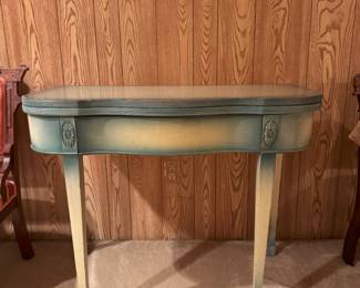 Underneath this blue baylage paint is a bridge table, probably mahogany.  It's even been used as a vanity.