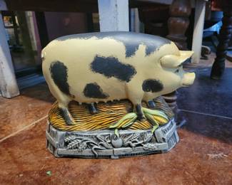Cast metal pig door stop