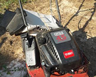 Toro mower with grass attachment, in very good running condition.