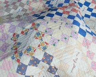 I just love this vintage friendship quilt. makes me wonder about the names that are sewn into it & it's history.