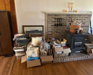 This pile will be more spread out during the sale. Books, curtains, picture frames. 