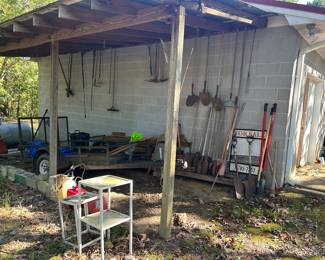 Yard tools and a tiny trailer. 