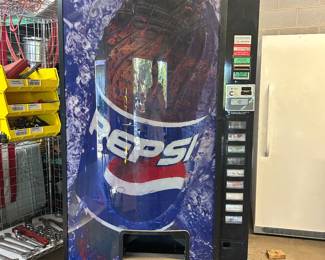 The soda machine gets cold. The key was lost, but you can buy a new lock on Amazon. 