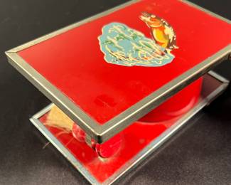 Shaving brush and cup in metal box with trout image on front