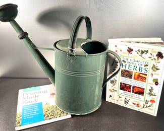 Large watering can, gardening books