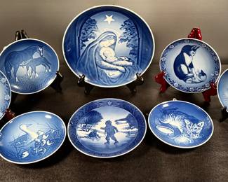 Center: Bing and Grondahl Madonna plate, 
Center below: Royal Copenhagen Boy Skating plate.
Animal images collector plates