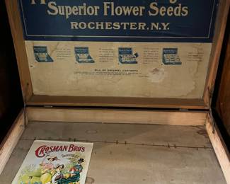 This is so Daggone cute! Solid wood Antique seed salesman display case! Pretty closed but neater open...showcase collectibles, flowers, vases, anything in this...so neat!