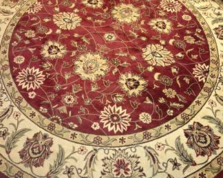 Round red floral area rug