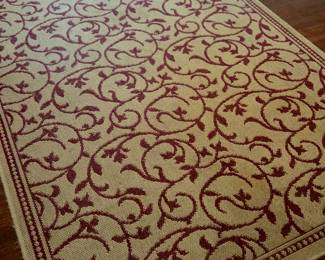 Rectangle red and tan floor rug