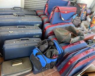 Lots of suit case luggage