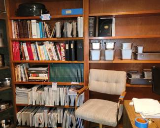 Cookbooks galore. Italian Grandmother's recipe pages. 2 of those swivel chairs are available. Desk is ready for it's new home.