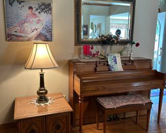 Piano. Side table. Lamps. Art.