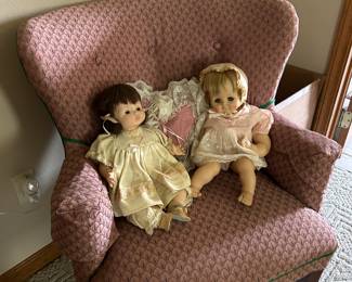 Chair and dolls.