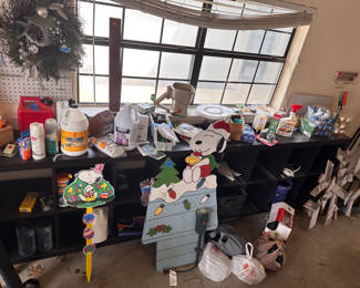 garage with tools, holiday, SNOOPY yard signs, cleaning products, wreaths, ornaments etc