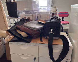 camera bags, laptop bags, file cabinets, chairs, art prints, and office supplies