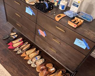 in the bedroom shoes, mid century modern dresser, and massage/spa day supplies