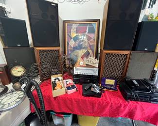 Vintage speakers. Panasonic CS – G404. KLH, Montgomery Ward, and pioneer CS – 99 a. Wine, racks, Asian dolls, and other decor and stereo equipment.