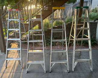 4 aluminum step ladders. 6 feet tall. Range from 200 pound capacity to 250 pound capacity.
