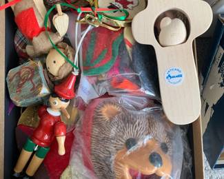 Various vintage wooden and corn husk Christmas ornaments.