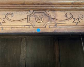 Fruitwood armoire carving.