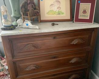 Marble top oak chest of drawers.