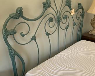Lovely iron scrolled bed.