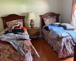 Two Thomasville twin beds. Vintage Croscill comforters, shams and bed skirts. Vintage lamp. Vintage table by Davis Cabinet Company.
