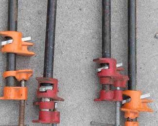 Lot 224. Four pipe clamps