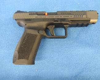 Lot 11. Canik TP9 FXS 9mm semi-auto pistol. Ser. 20 BC48799. Includes two magazines, four scope mounting plates, manual, holster, and case.
