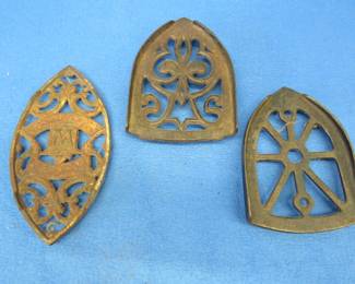 Lot 211. Three antique iron trivets