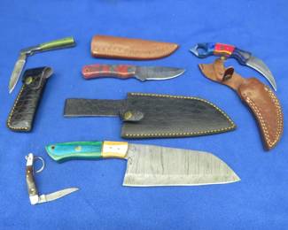 Lot 357. Six new Damascus knives. Five with leather sheaths.