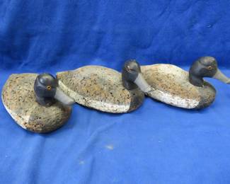 Lot 250. Three vintage rigmate cork canvasback decoys with glass eyes and swivel heads in excellent condition
