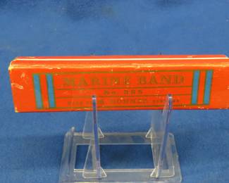 Lot 79. Hohner 6 1/4" hole diatonic harmonica in the key of C. Sounds great. Box is in excellent condition.