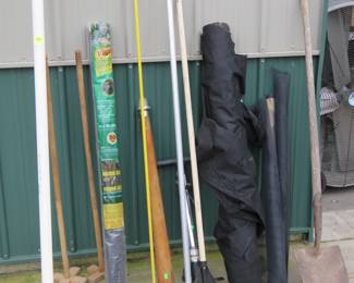 Lot 221. Long-handled tools including a vintage wooden boat light, ice chisel, weed barrier, and more