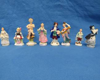 Lot 31. Eight figurines all are marked "Made in Occupied Japan"