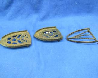 Lot 81. Three iron trivets