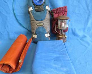 Lot 241. Coleman lantern, Camel Back canteen, tarp, and seat