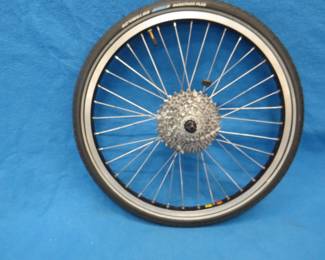 Lot 380. Shimano Deore 9-sprocket bicycle wheel on a Sun CR18rim