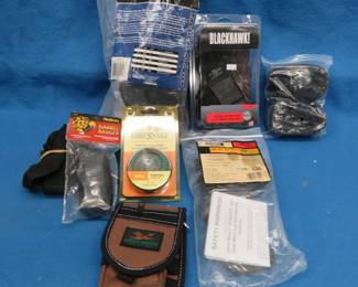 Lot 179. NIP holsters, straps, gun snakes, and more