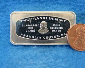 Lot 163. Franklin Mint Bank-marked sterling silver ingot. 65.6 grams.