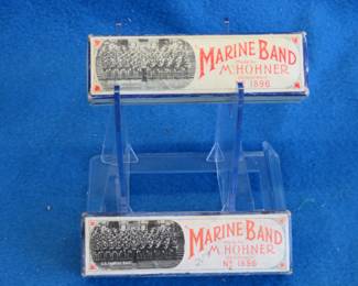 Lot 283. Hohner Marine Band harmonica in the key of C in the box with papers in fair condition.